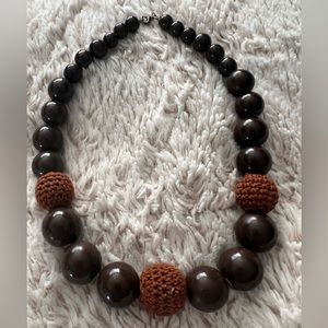 Brown beaded necklace with clasp closure